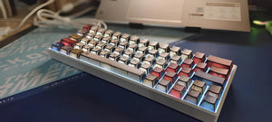 User typing on a keyboard with Multi Comics Styles keycaps for a fun vibe